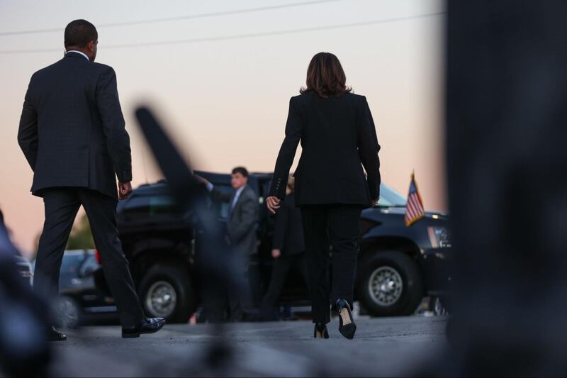 Kamala Harris brings flowers to the Monterey Park vigil after a mass shooting at a local dance studio.