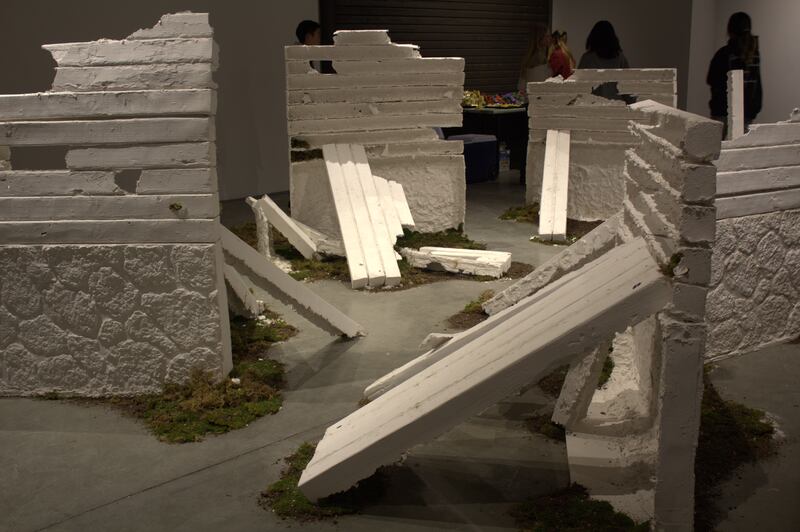 Artwork titled "Hold it Tightly, Let go Lightly" by Shea Noland. This artwork resembles a house's ruins, which reminds Noland that tangible objects can be destroyed, but only memories last forever.