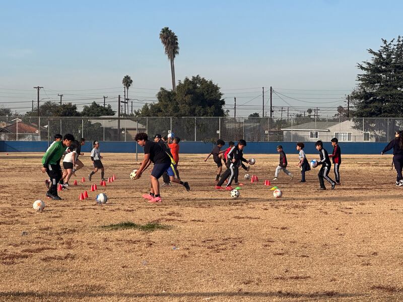 ThinkWatts’ soccer players practice their footwork with their partners to begin every Saturday Session. (Photo/Jude Ocanas)