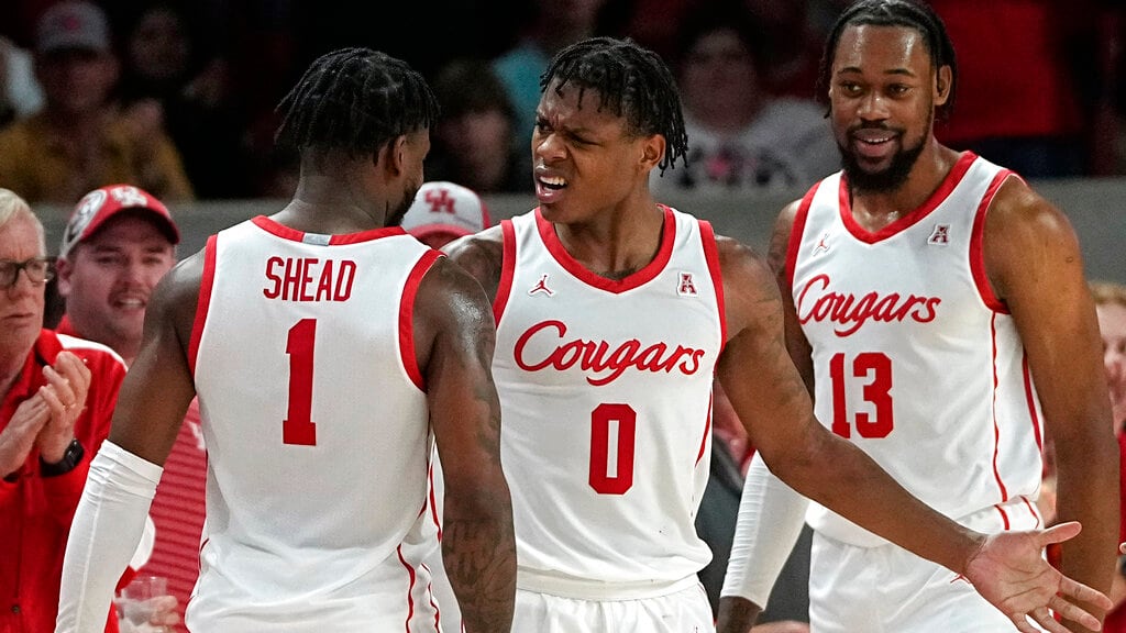 Houston teammates celebrate with each other.