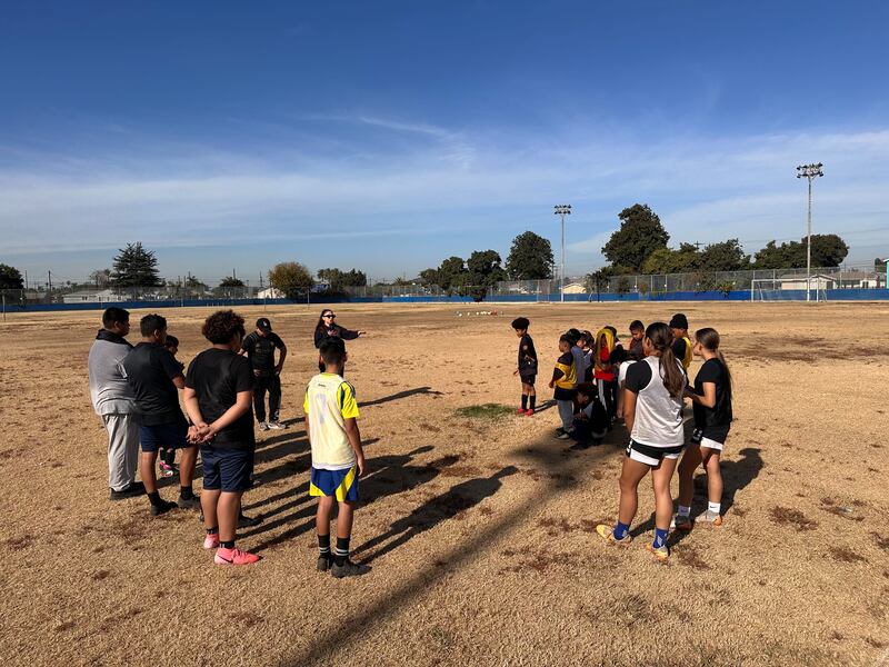 Coach Rodolfo Lopez and Program coordinator Angelica Urquidez address the team about goals for the new year on Dec. 14, 2024. (Photo/Jude Ocanas)