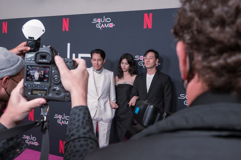 "Squid Game" cast Lee Jung-jae, Jung Ho-yeon and Park Hae-soo being the center of attention of photographers at the red carpet event for "Squid Game" on Nov. 8 2021, at the NeueHouse Hollywood, Los Angeles.