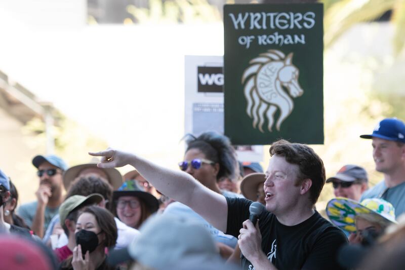 A popular D&D host and guest speaker role-plays to the gathered group of D&D players.