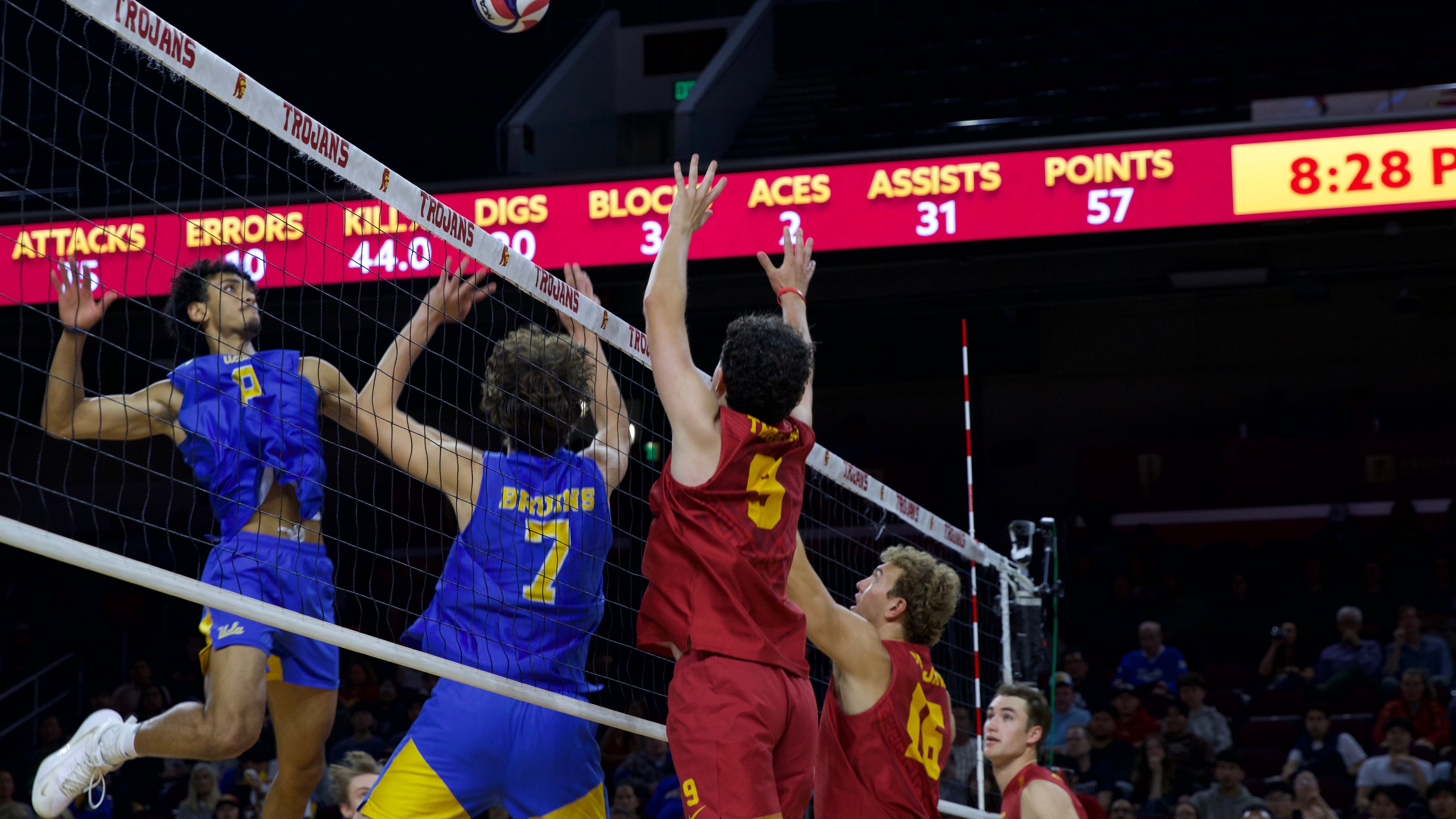 Micah Wong Diallo (8) elevates over a USC block at the net at Galen Center.