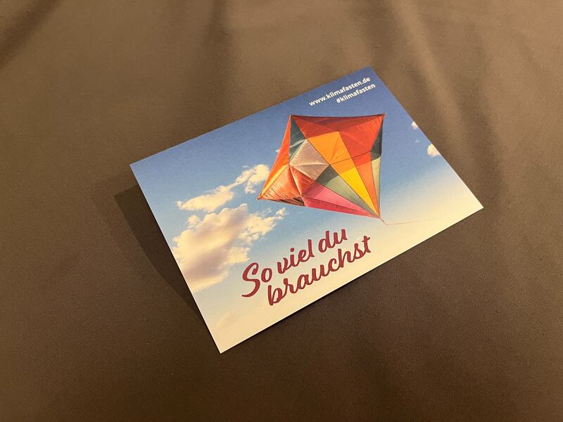 Photo of a flyer saying "So viel du brauschst," which translates to "As much as you need" in English.