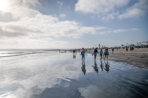 Some Orange County beaches remain open after drawing crowds