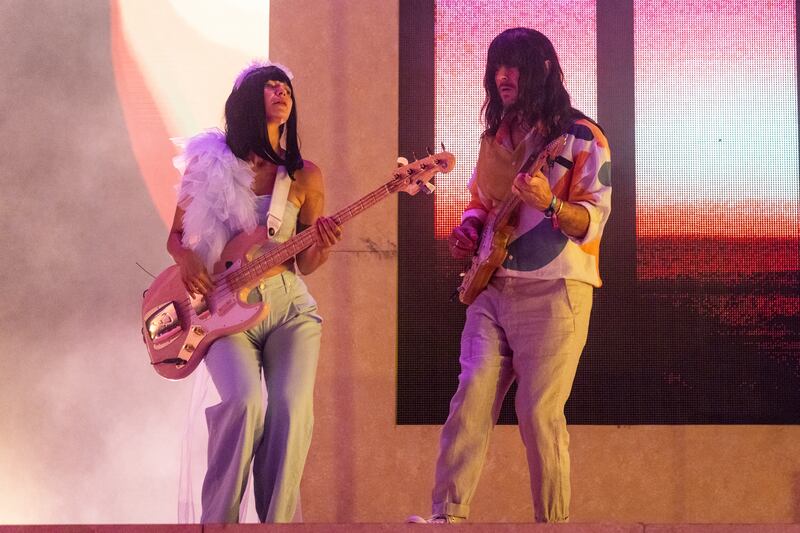 Photo of two performers on a stage.