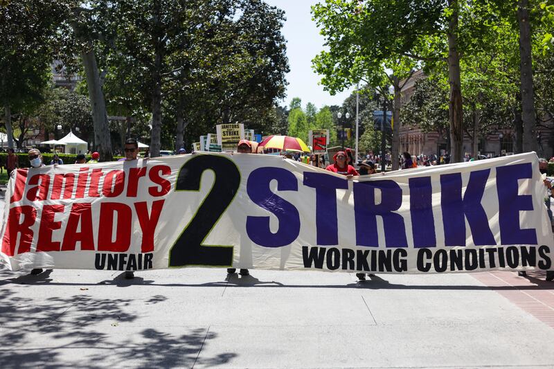 Janitors and custodians protest to acquire higher wages and better their working conditions at USC on Thursday, April 7, 2022.
