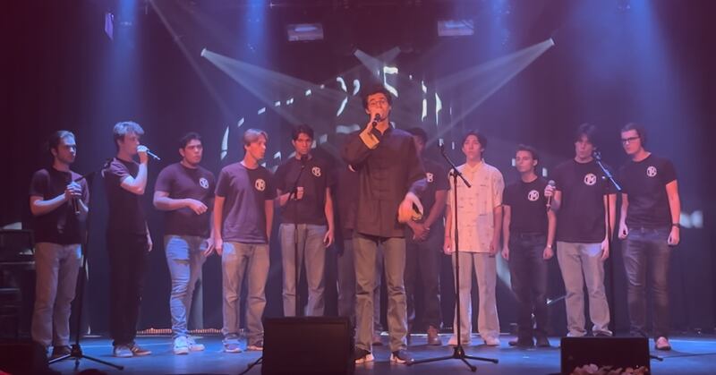 James Roth sings a Chinese song with his acapella group, Trojan Men.