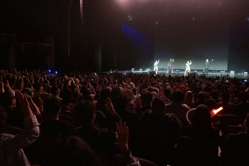 People dancing to the performance on stage