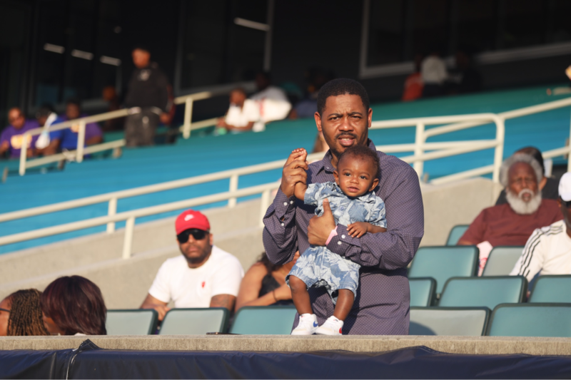 A father and a young fan look on as the next generation of HBCU talent prove their abilities on the field.