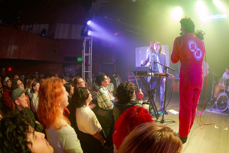 Camera man filming and artist