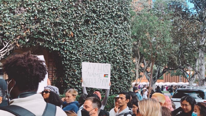 A student holds a sign that reads “Say his name Wadea Al-Fayoume,” commemorating the 6-year-old Palestinian boy who was stabbed to death near Chicago.