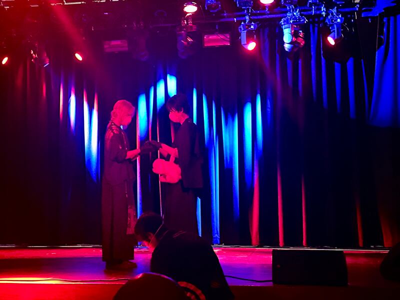 Dudu on stage with her collaborator.