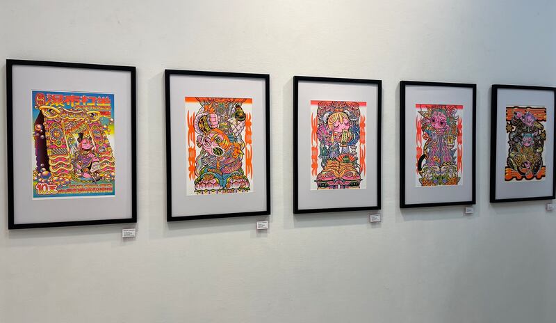 Photo of five paintings featuring complex and vibrant colors