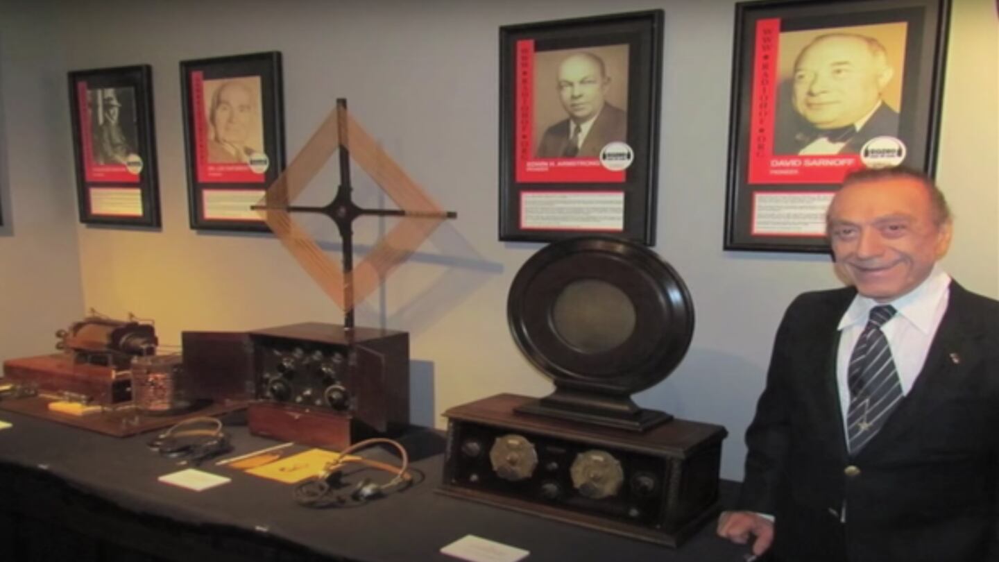 Photo of late radio show host Art Laboe posing next to radio equipment, courtesy of Music ConnectionMag