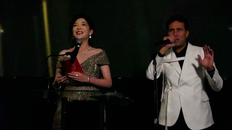 Person speaking into a microphone