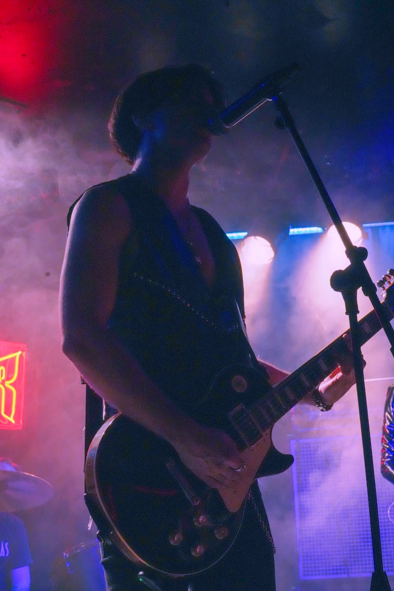 Musician with guitar.