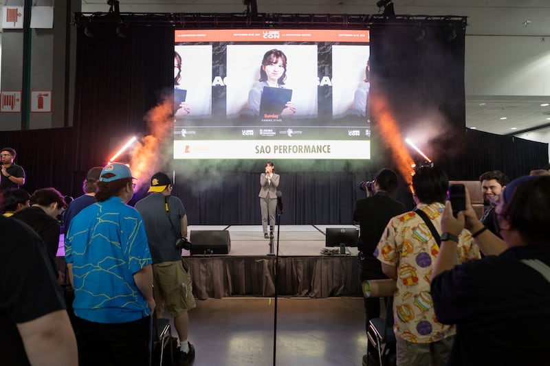 Saori Araki speaking to fans in an audience