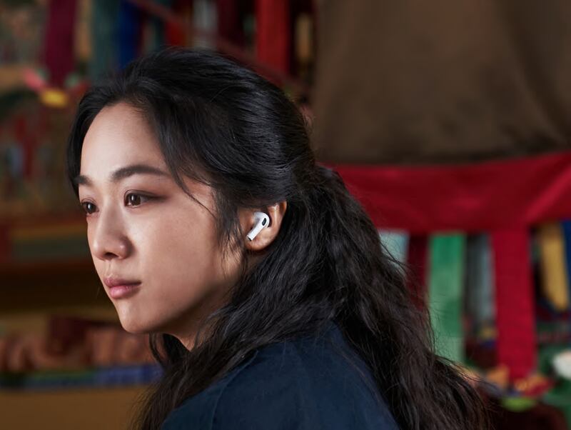 Film shot of a woman with a bluetooth earbud