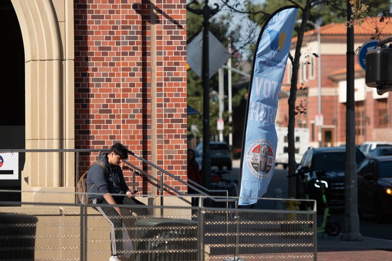 A banner to vote sits on the corner of the USC Village on 32nd St. and Hoover St.