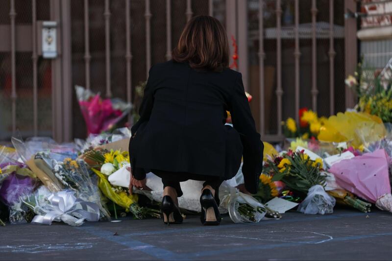 Kamala Harris brings flowers to the Monterey Park vigil after a mass shooting at a local dance studio.