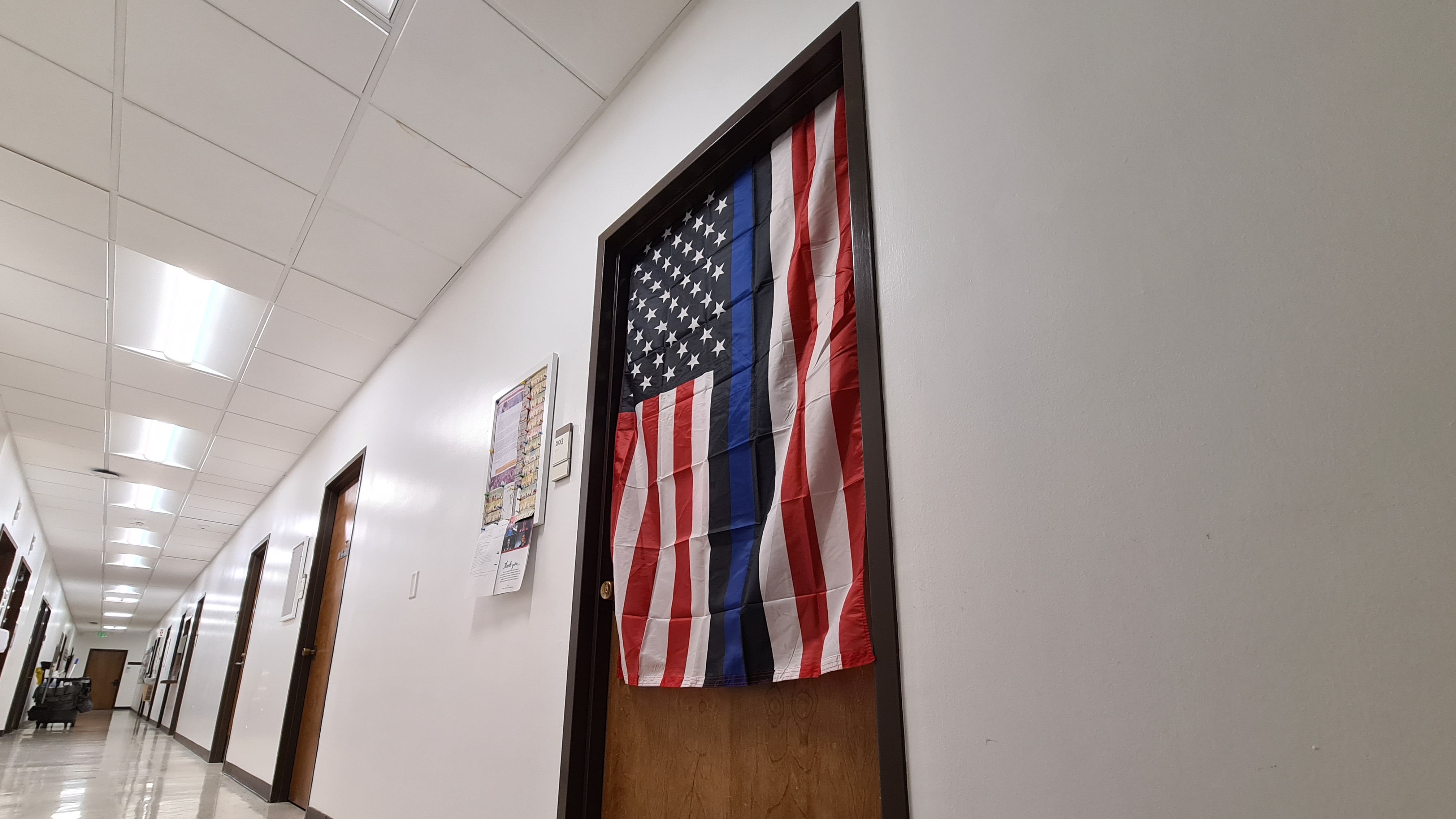A Blue Lives Matter flag hangs outside Industrial and Systems Engineering Professor James Moore's office at the Andrus Gerontology Center.