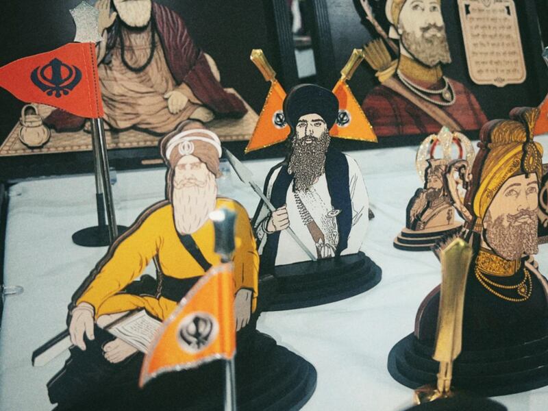 DESCRIBE THE IMAGE FOR ACCESSIBILITY, EXAMPLE: Photo of a chef putting red sauce onto an omelette.