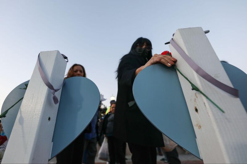 Photographs of a vigil outside the Monterey Park civic center held for the victims of the Monterey Park mass shooting.
