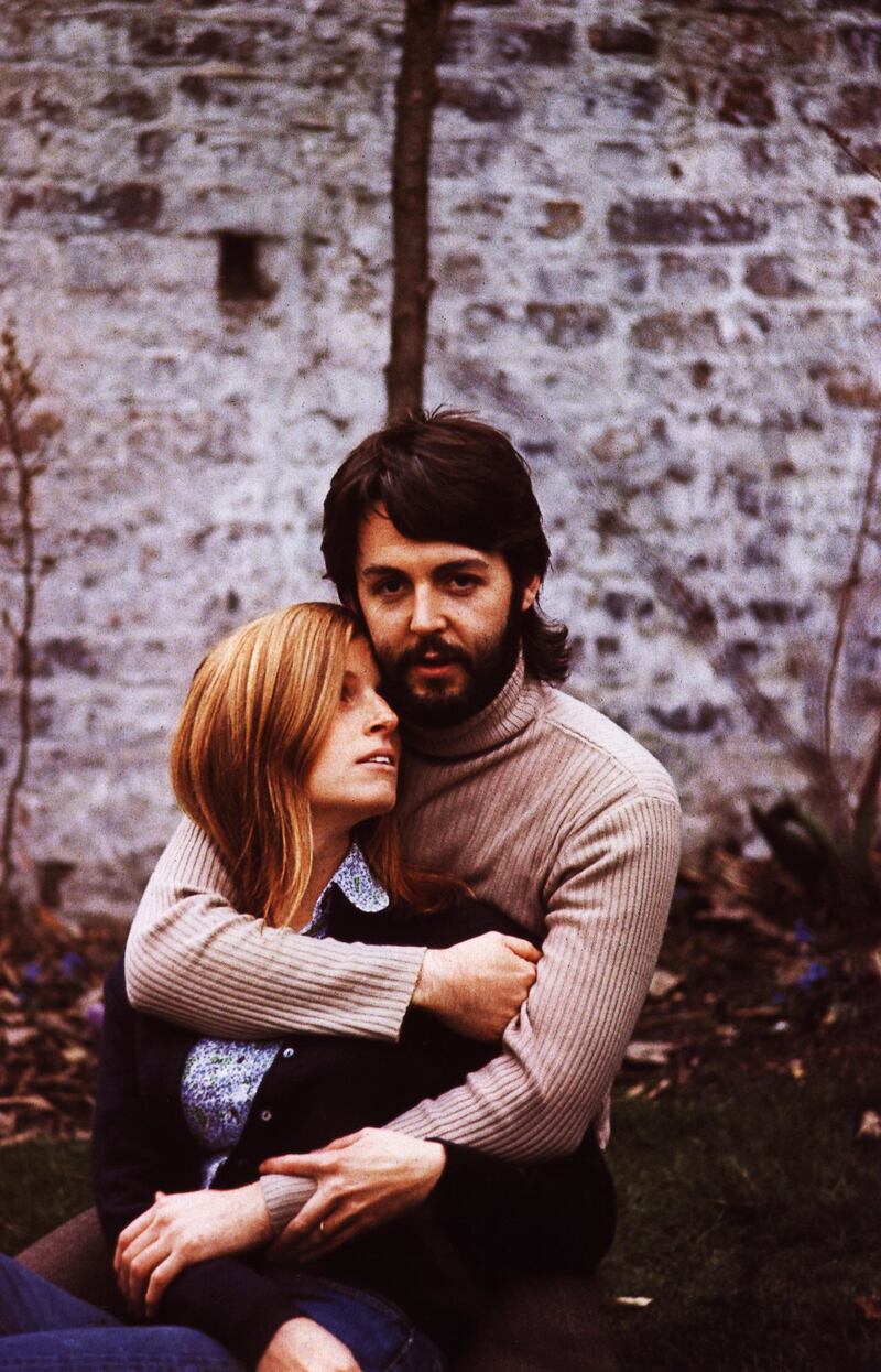 Paul and Linda McCartney embrace.