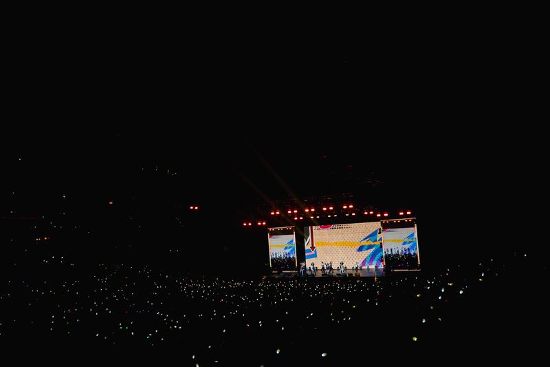 Artist dancing and performing on stage from afar