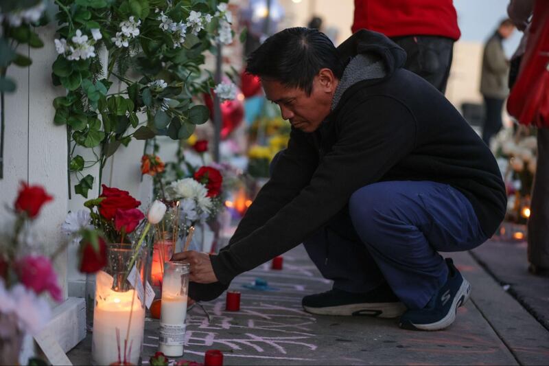Kamala Harris brings flowers to the Monterey Park vigil after a mass shooting at a local dance studio.