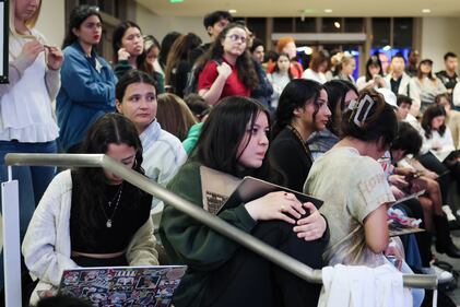 DESCRIBE THE IMAGE FOR ACCESSIBILITY, EXAMPLE: Photo of a chef putting red sauce onto an omelette.
