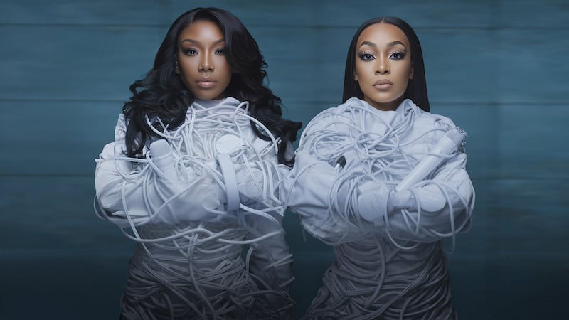Brandy and Monica are in an all-white costume to promote their "The Boy is Mine" tour.