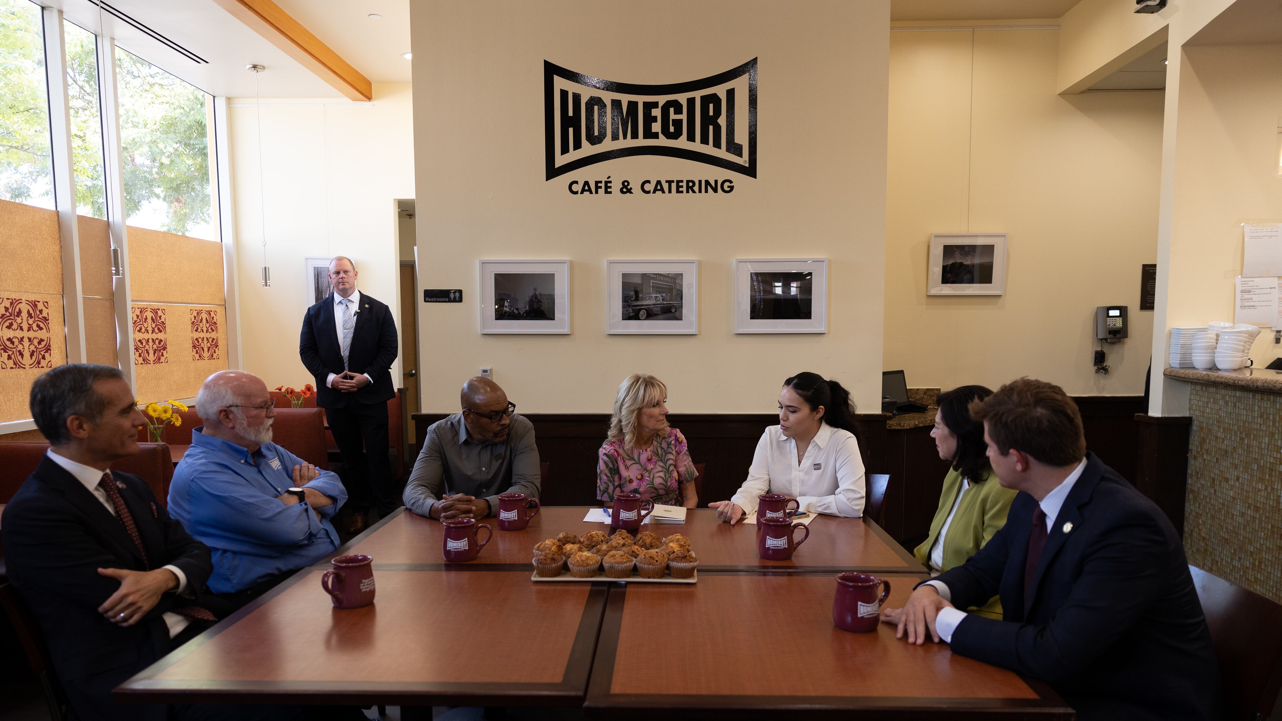 Jill Biden and Homeboy Industries sit at brown table for discussion.