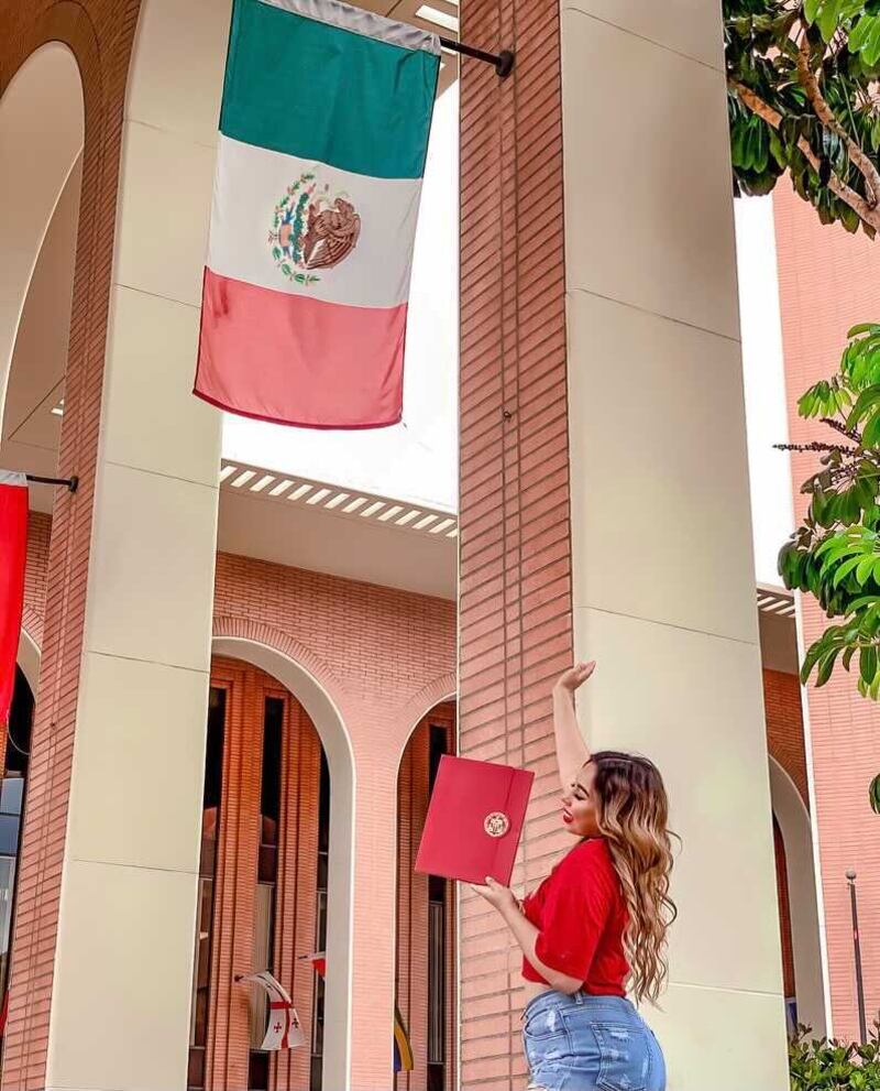 Photo of of Karla Lopez in front of the Mexican flag
