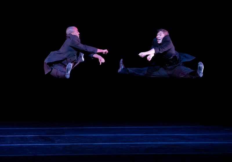 Renaldo Maurice and Patrick Coker jumping and smiling in the joyful choreography of "Ella."