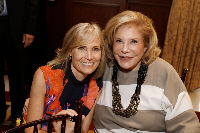 USC Annenberg Dean Willow Bay poses for a photo on the left; on the right is USC Life Trustee Wallis Annenberg. The two women are smiling.