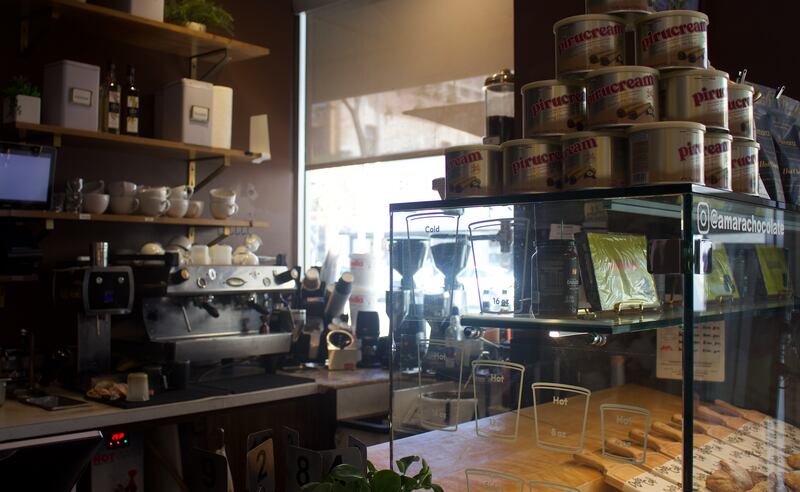 Photo of a coffee counter with coffee products around it.