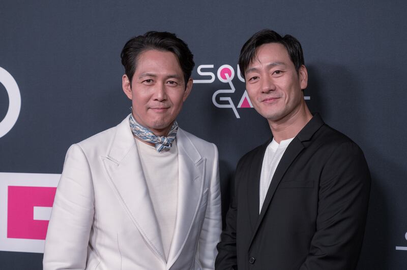 Lee Jung-jae and Park Hae-soo who play Seong Gi-hun and Cho Sang-woo respectively in "Squid Game" at a Red Carpet event hosted by Netflix at NeueHouse Hollywood on Nov 8 2021.