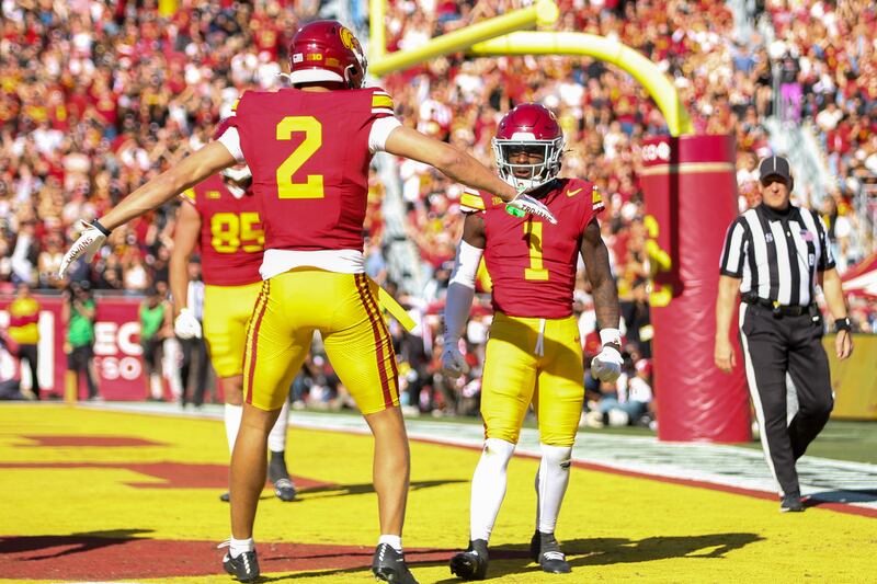 A photo of Zachariah Branch and Duce Robinson celebrating a touchdown.