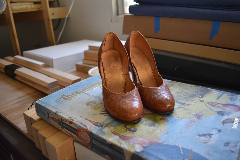 As artist Phung Huynh prepared to create 'Sobrevivir,' she drew inspiration from this pair of Mexican leather-tooled heels she found at a vintage shop in South Pasadena. Their beautiful hand-tooled elaborate designs reminded her of human skin, suffering but also transformation. July 29, 2022. Photo by Citlalli Chávez-Nava