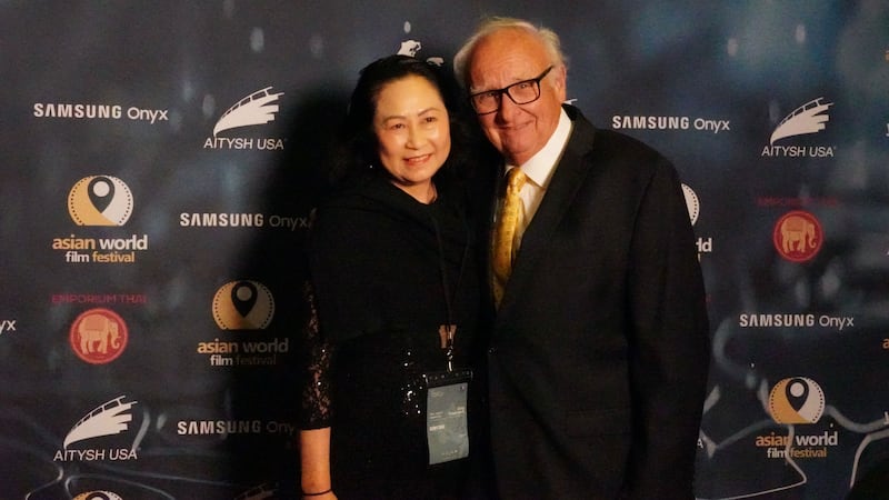 People taking a photo on a red carpet