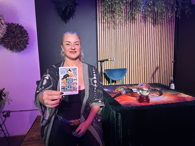 Tarot reader Jovan Illa shows off her tarot cards.