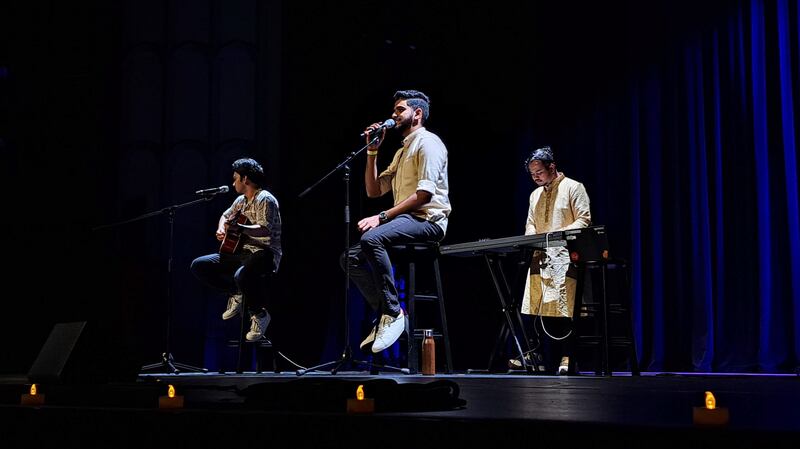 Students sing a series of Bollywood songs inviting the audience to participate.