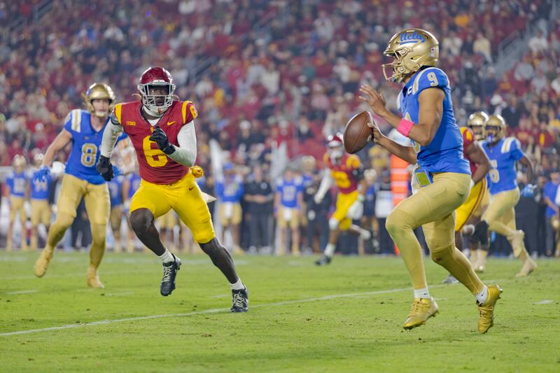 Football player running at another