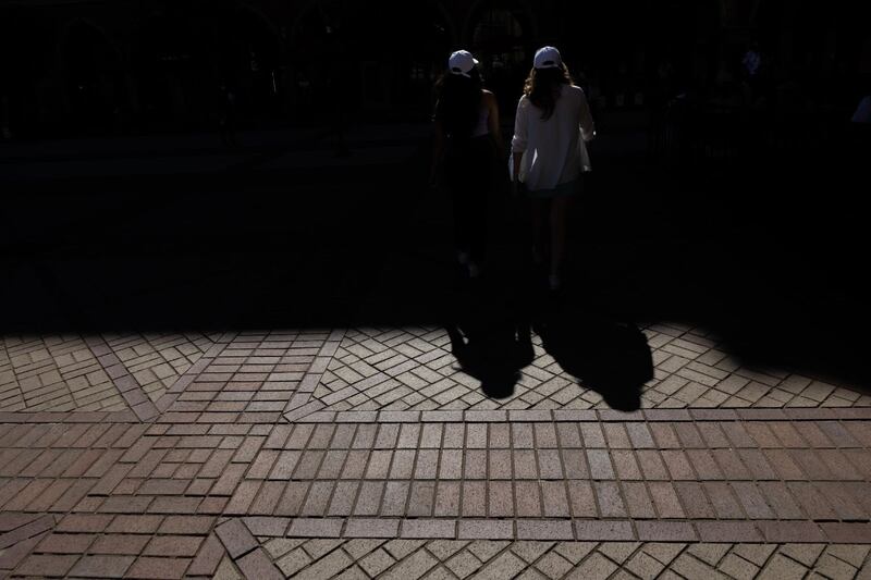 Woodworth and Krishnan walking into shadows.