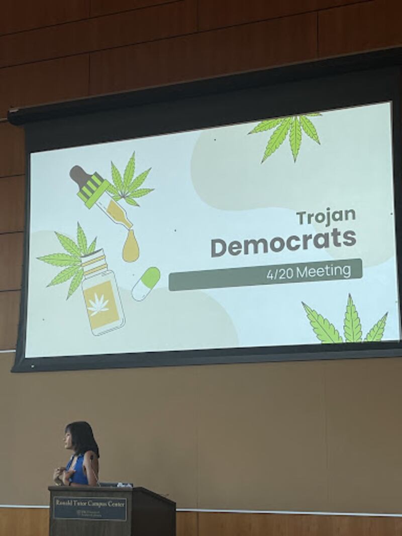 A photo of a student giving a Powerpoint presentation.