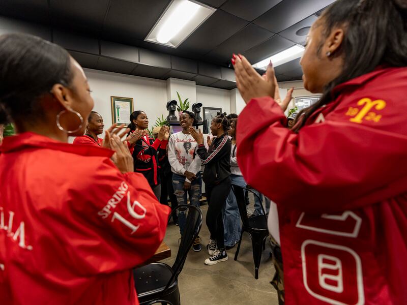 DESCRIBE THE IMAGE FOR ACCESSIBILITY, EXAMPLE: Photo of a chef putting red sauce onto an omelette.