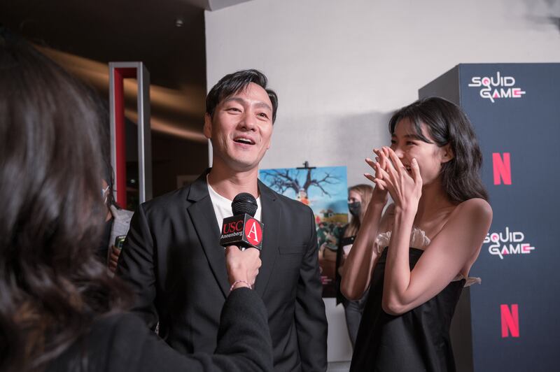 Jung Ho-yeon and Park Hae-soo being interviewed by Annenberg Media at the "Squid Game" Red Carpet event hosted by Netflix at NeueHouse Hollywood.